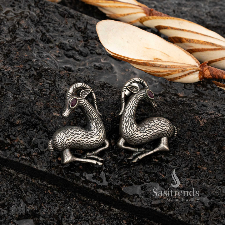 Silver oxidised deer earrings with ruby stone, intricate wavy texture - Sasitrends