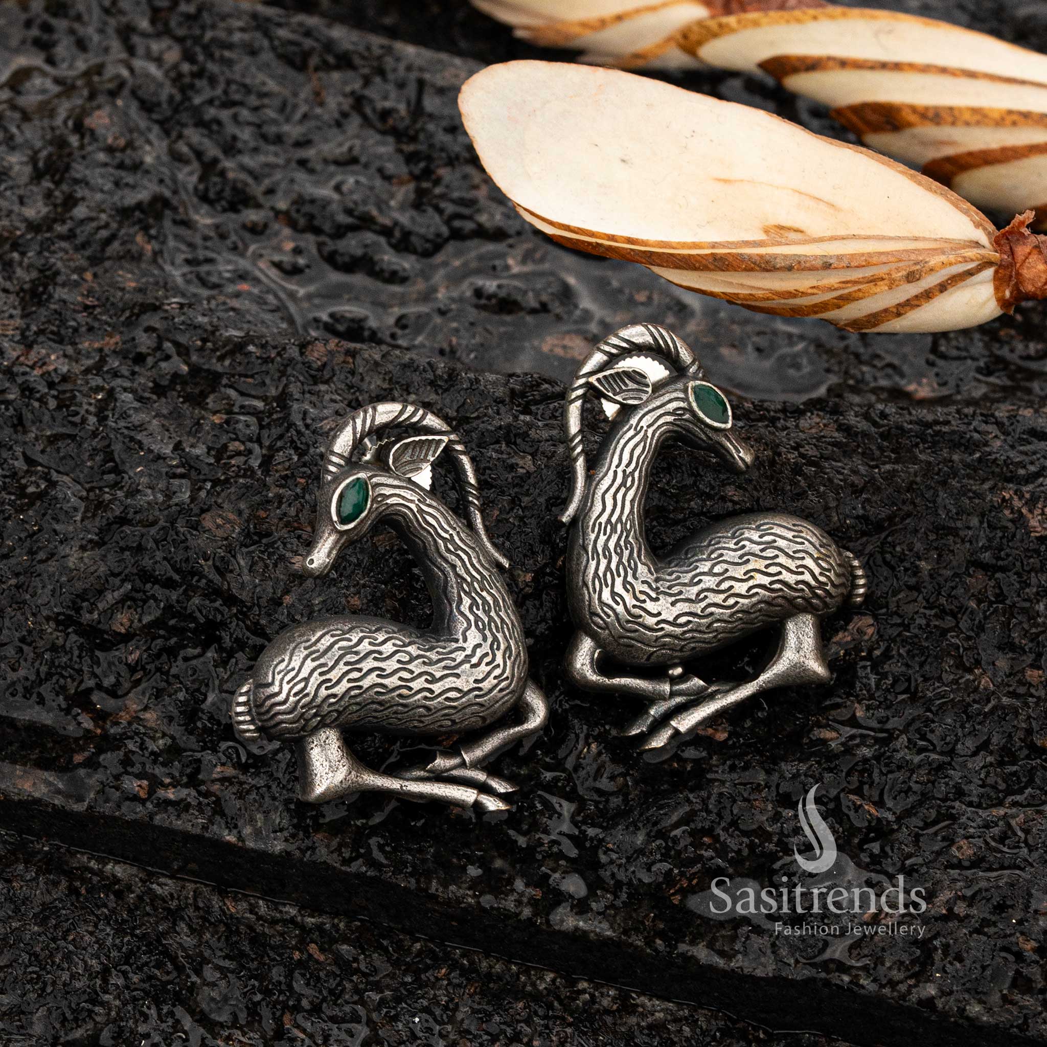 Traditional oxidised silver deer earrings with green stone detailing - Sasitrends