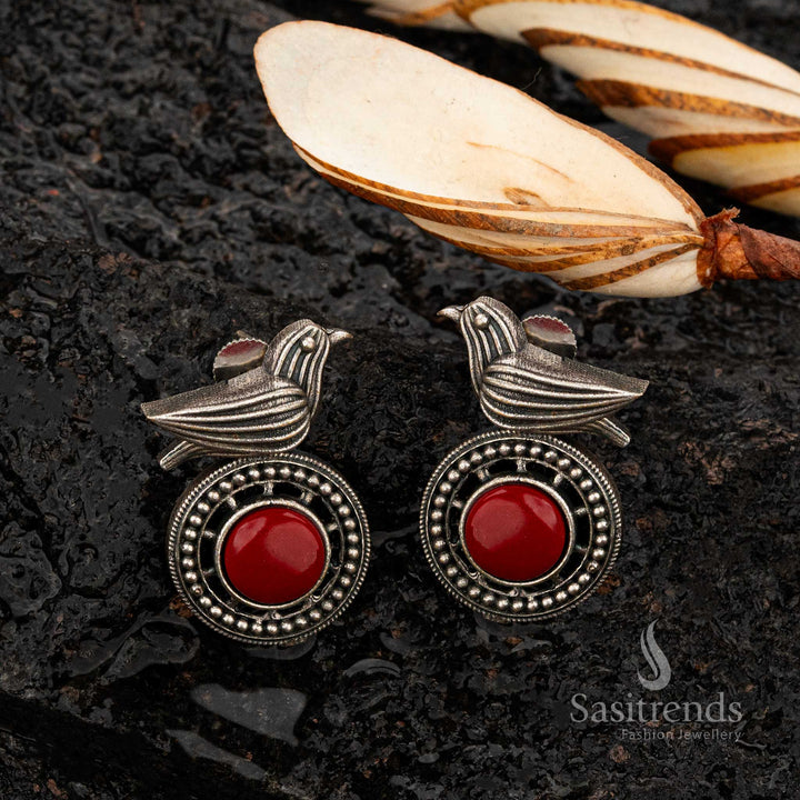 Ruby bird motif oxidised silver earrings with round cabochon stone - Sasitrends