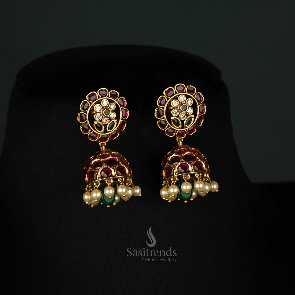 Majestic regal matte gold plated ruby-green flower heritage earrings, crafted with traditional motifs and elegant detailing - Sasitrends