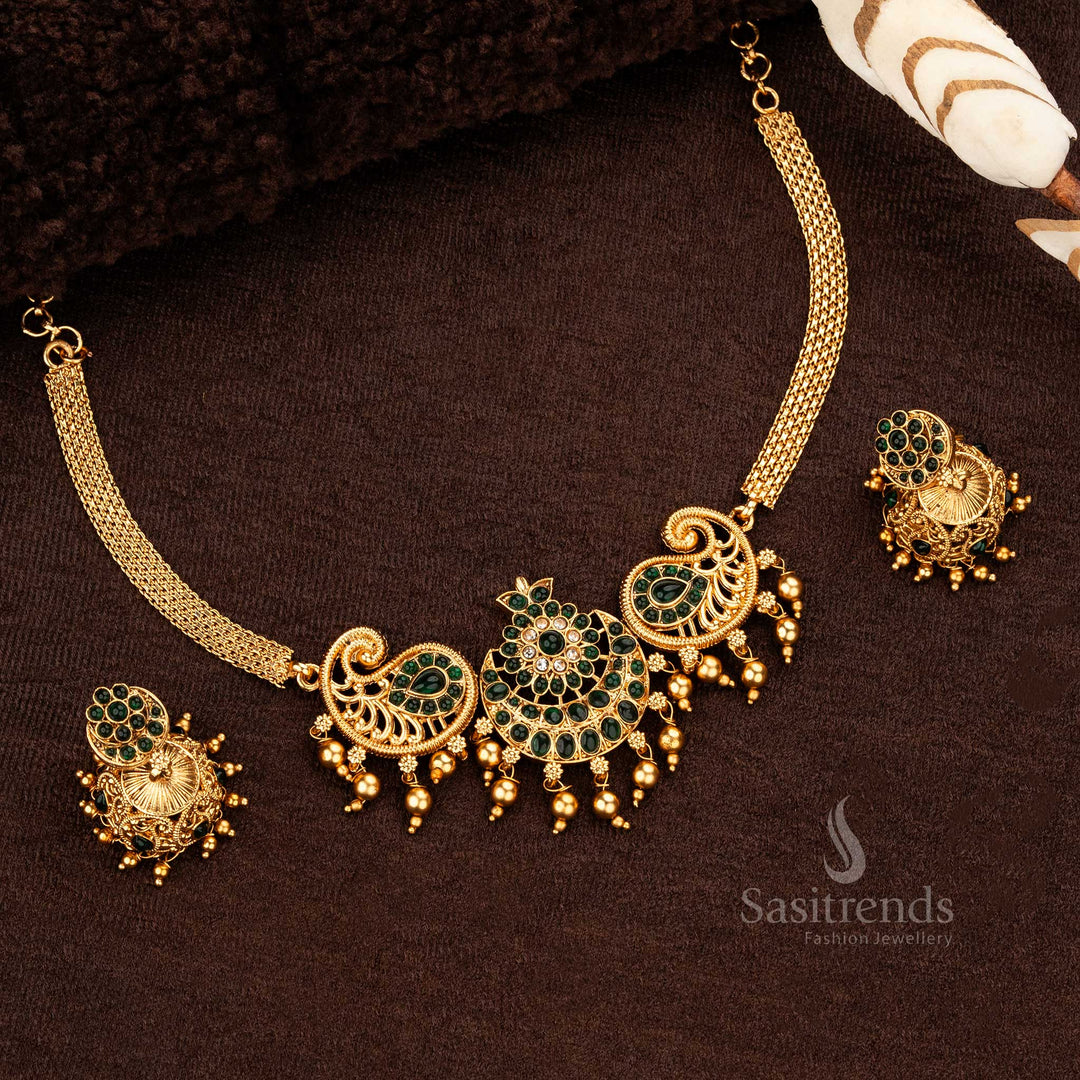 Intricate paisley motif temple necklace with matching green jhumka earrings - Sasitrends