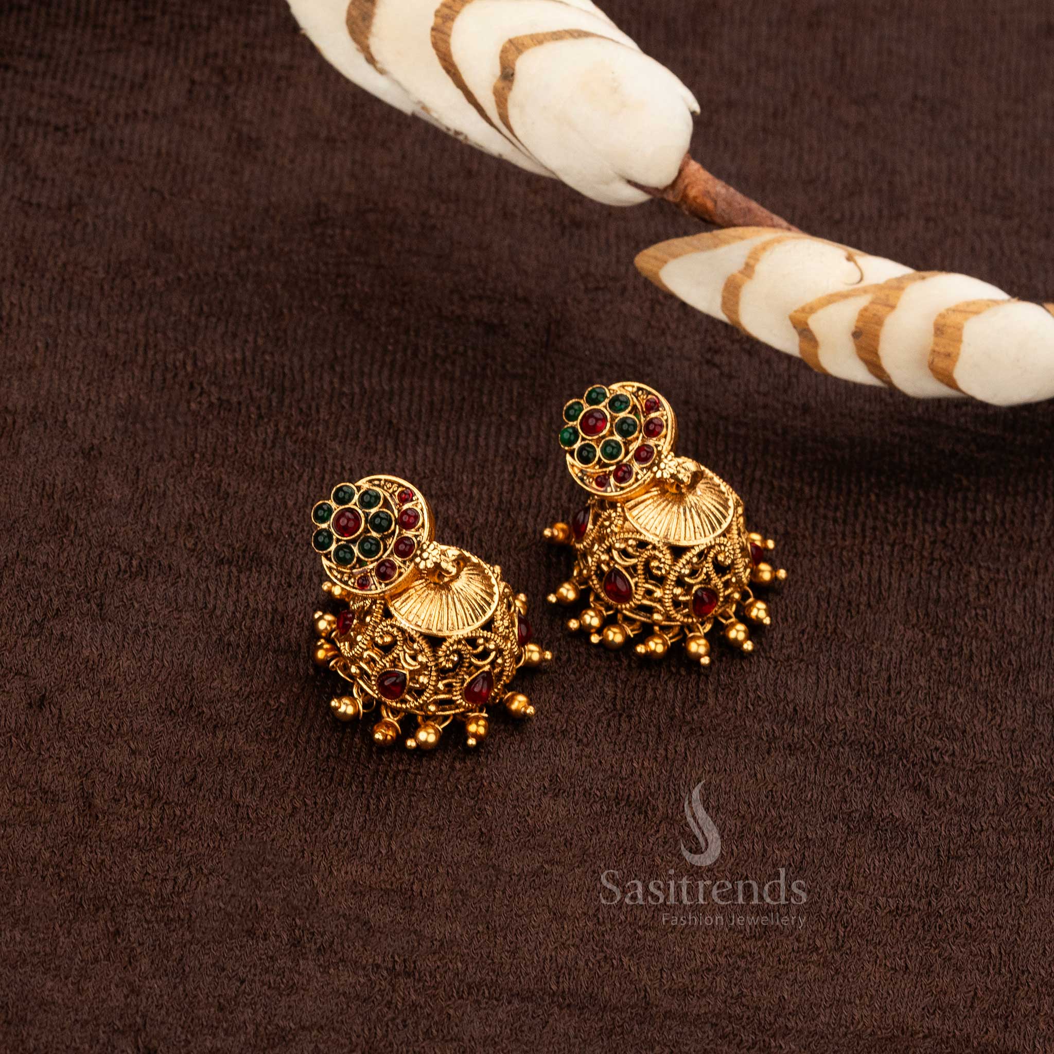 Classic temple ruby green jhumka earrings with golden bead hangings - Sasitrends