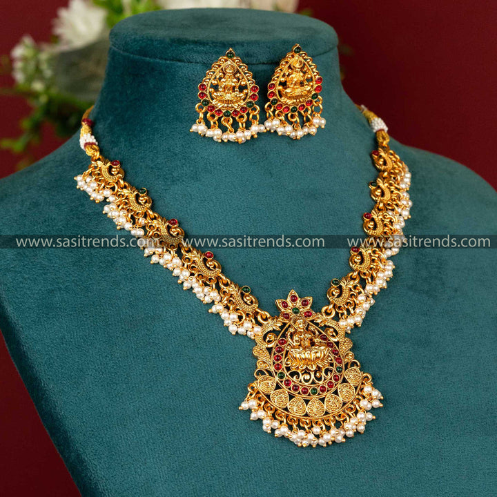 Stunning Matte Gold Plated Temple Lakshmi Peacock Jewellery Set for Brides with Ruby and Green Stones and Pearl Stud Earrings, Temple Jewellery, Latest Trends