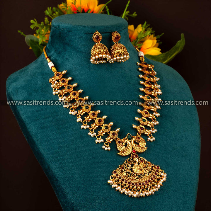 Temple-Matt-Gold-Plated-Necklace-SetStunning Matte Gold Plated Temple Peacock Jewellery Set for Brides with Ruby and Green Stones and Jhumka Earrings, Temple Jewellery, Latest Trends