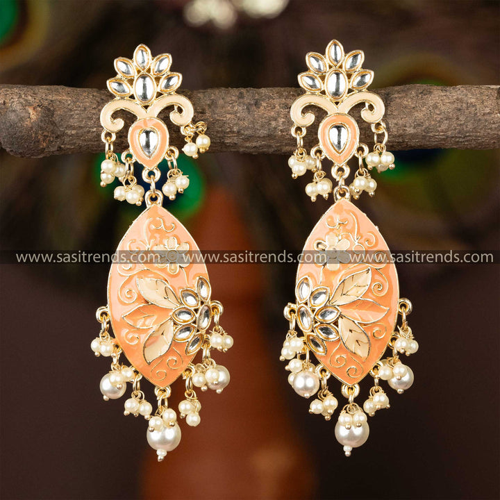 Charming peach enamel kundan earrings with gold plating and pearl dangles.