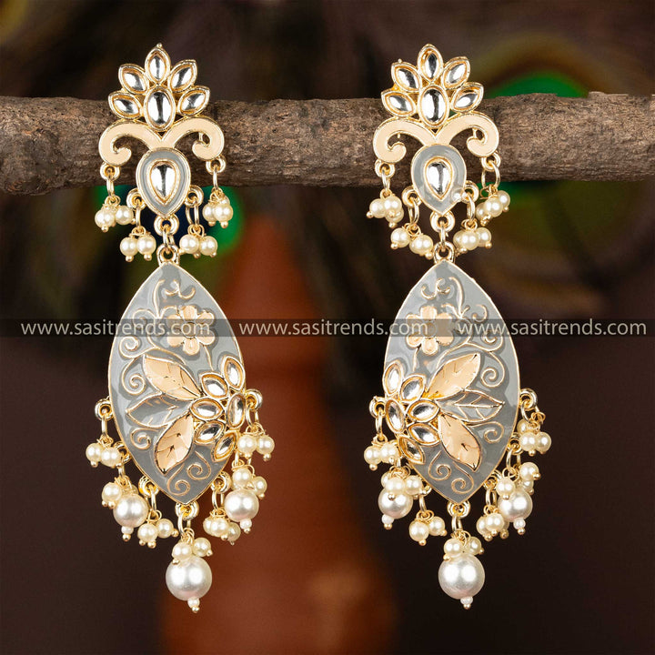 Exquisite gold-plated kundan earrings with grey enamel detailing and pearls.