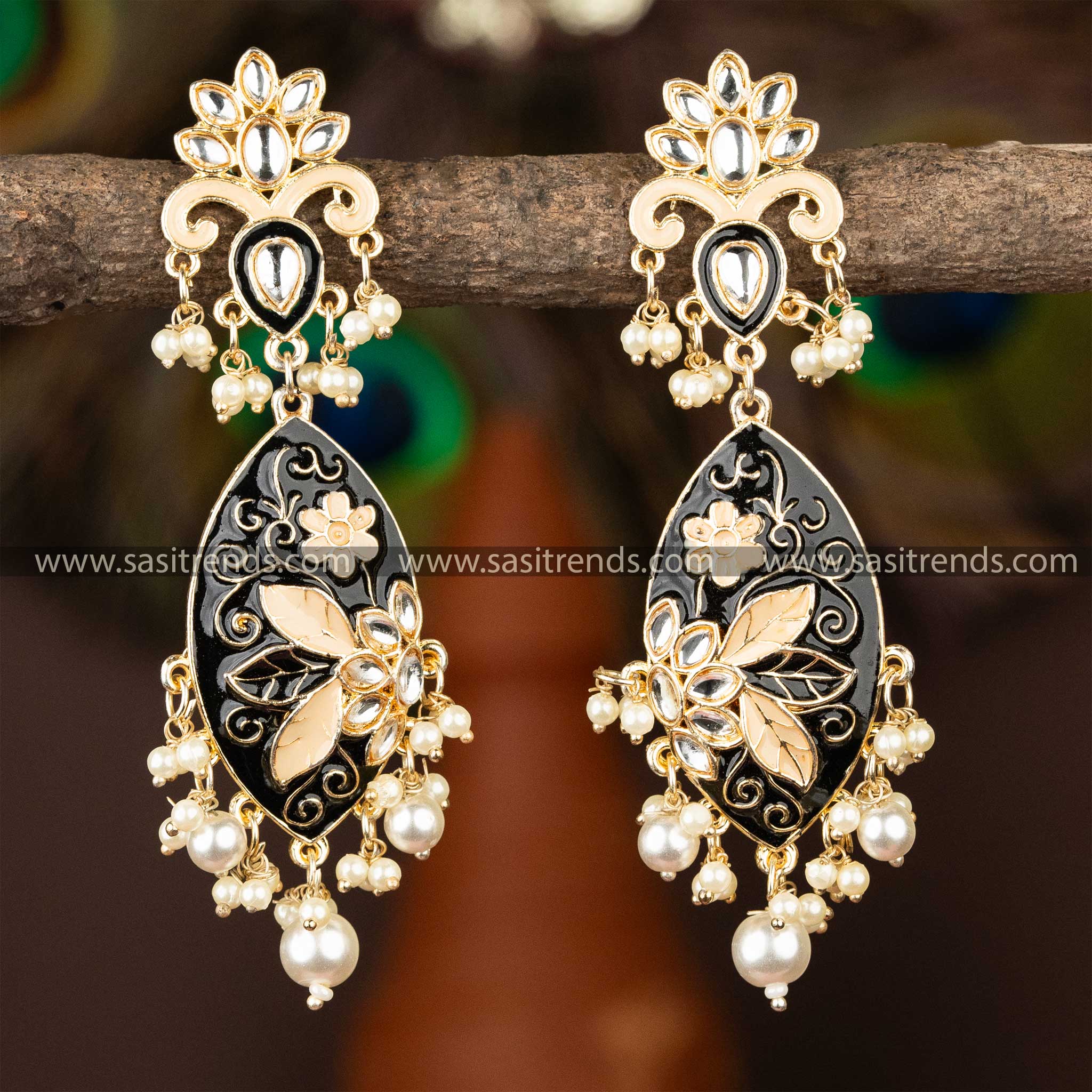 Classic black enamel kundan earrings with gold plating and pearl adornments.