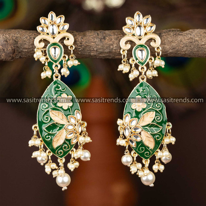 Elegant dark green enamel kundan earrings with gold plating and lustrous pearls.