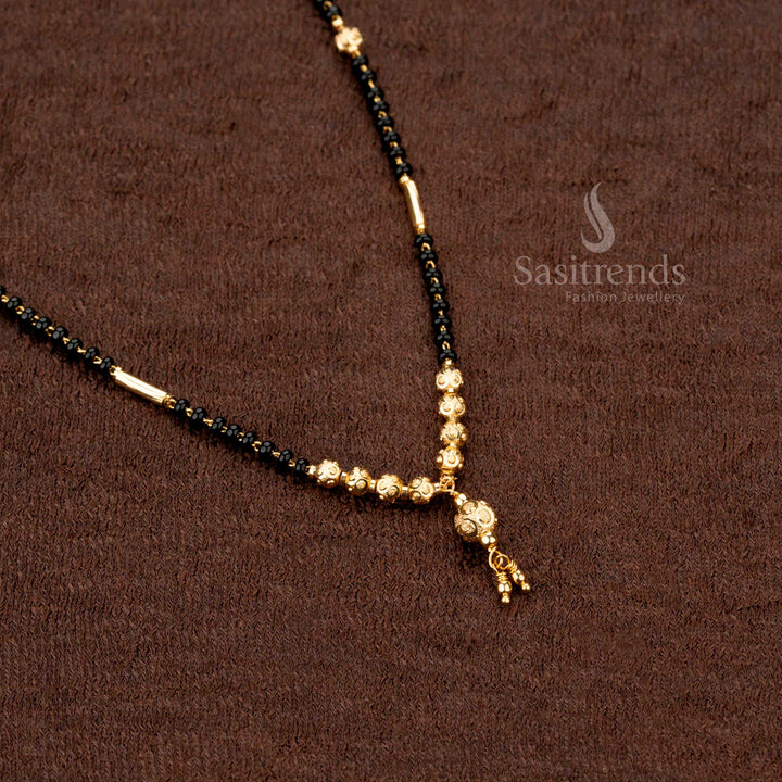 Charming ethnic gold-plated mangalsutra with black beads and artisanal beaded chainwork, a must-have jewellery piece for traditional wear - Sasitrends