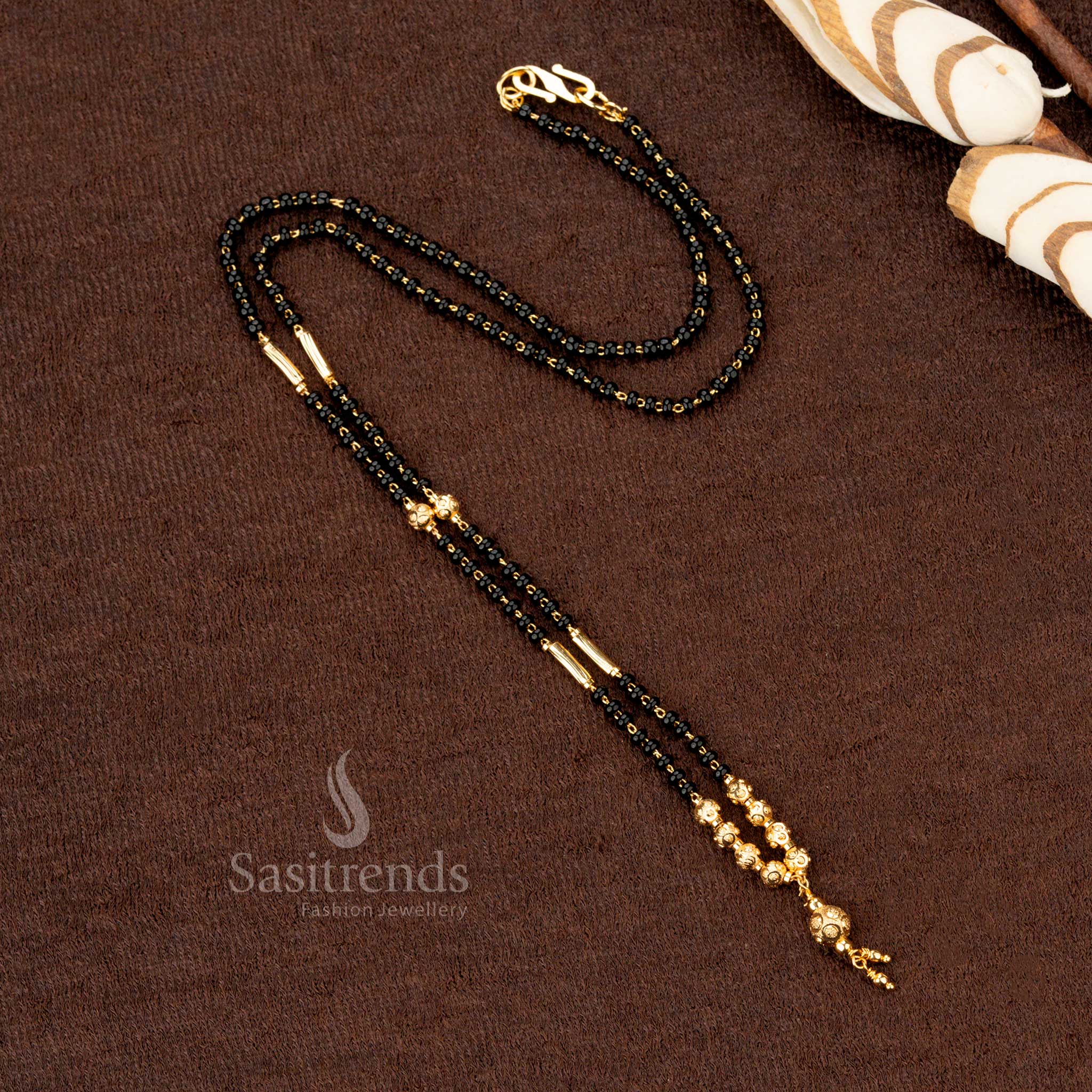 Captivating gold-plated black beads mangalsutra with a refined handcrafted beaded chain, embodying beauty and sophistication - Sasitrends