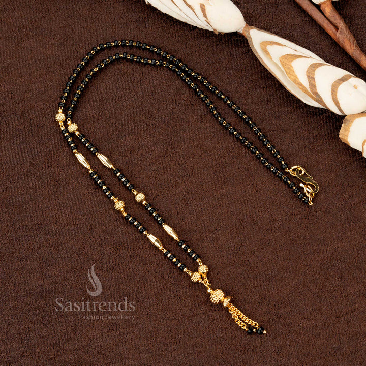 Luxurious gold-plated black beads mangalsutra with an ornate beaded chain and traditional accents, crafted for grand celebrations - Sasitrends