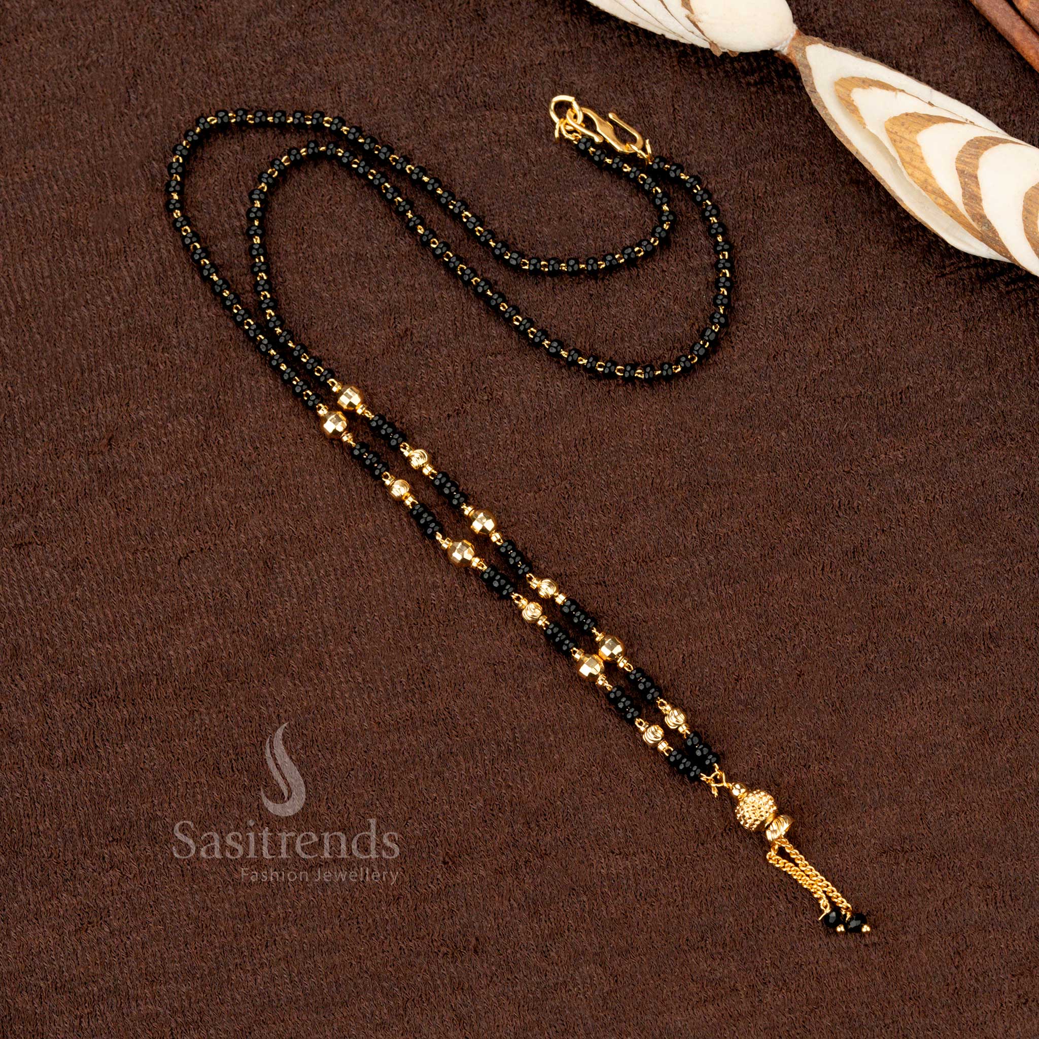 Graceful traditional mangalsutra with black beads and a delicate gold-plated beaded chain, an elegant jewellery piece for all occasions - Sasitrends