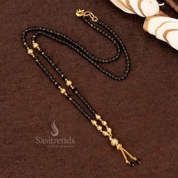 Regal gold-plated mangalsutra with a beaded chain and elegant black beads design, reflecting sophistication and grace - Sasitrends