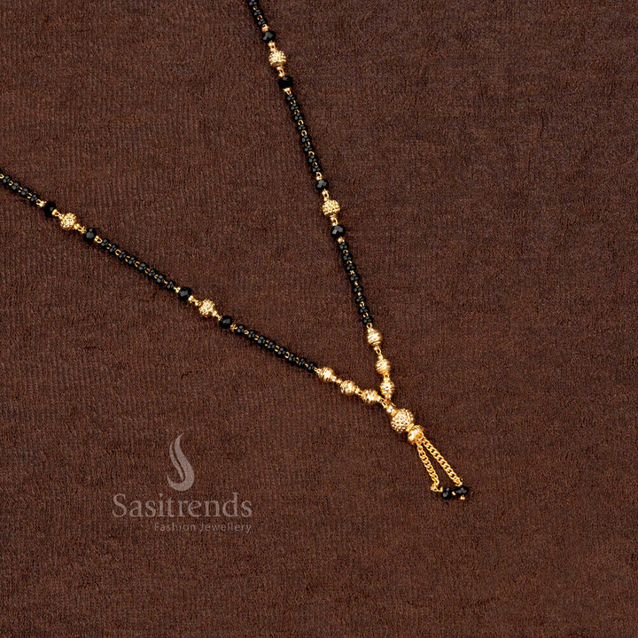 Divine gold-plated beaded mangalsutra with intricate black beads and traditional motifs, enhancing ethnic charm and beauty - Sasitrends