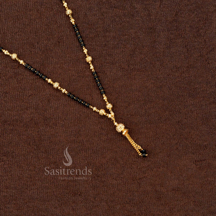 Lavish handcrafted gold-plated mangalsutra featuring black beads and an artistic beaded pattern, an exquisite addition to ethnic jewellery - Sasitrends