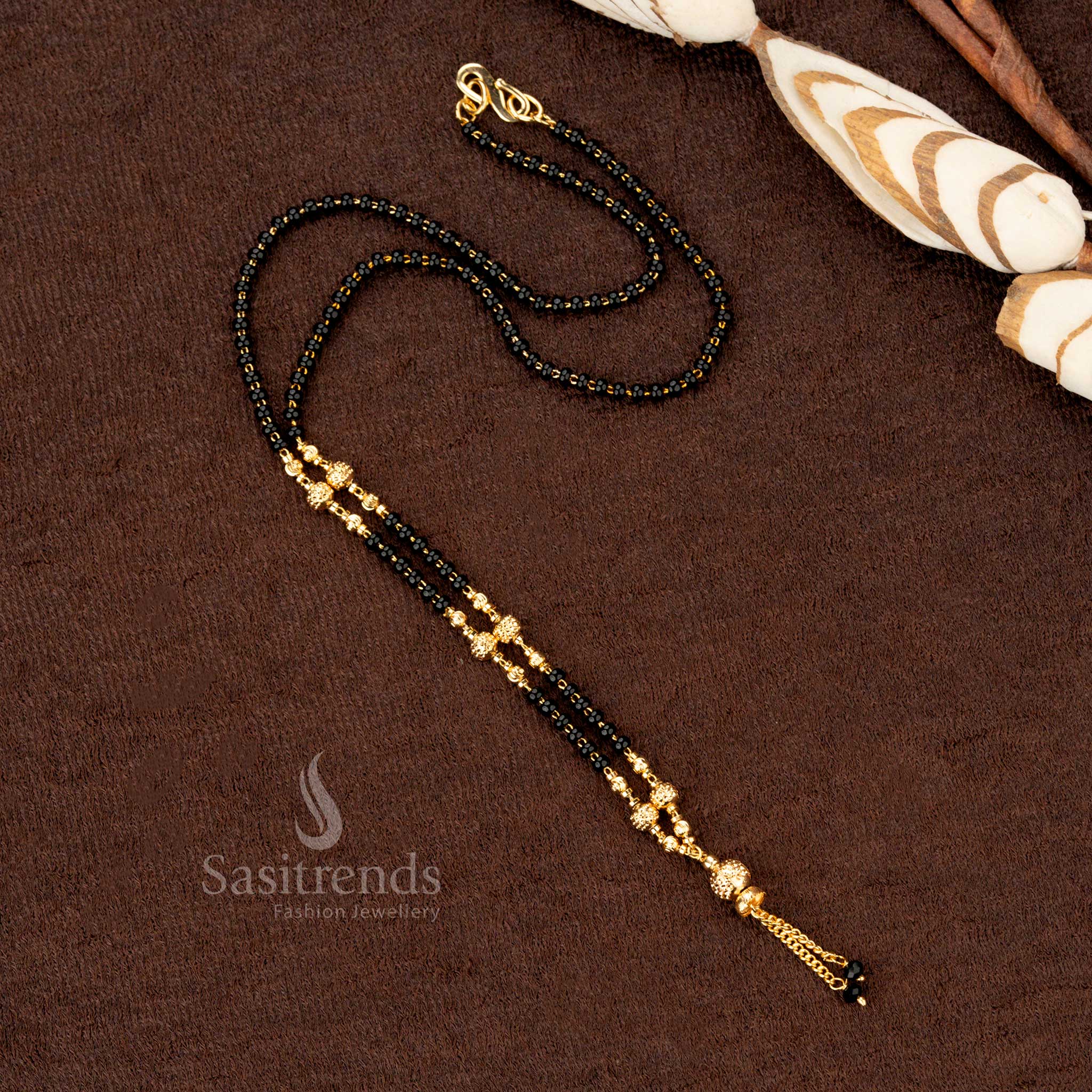 Opulent gold-plated beaded mangalsutra adorned with black beads and a traditional filigree design, perfect for cultural elegance - Sasitrends