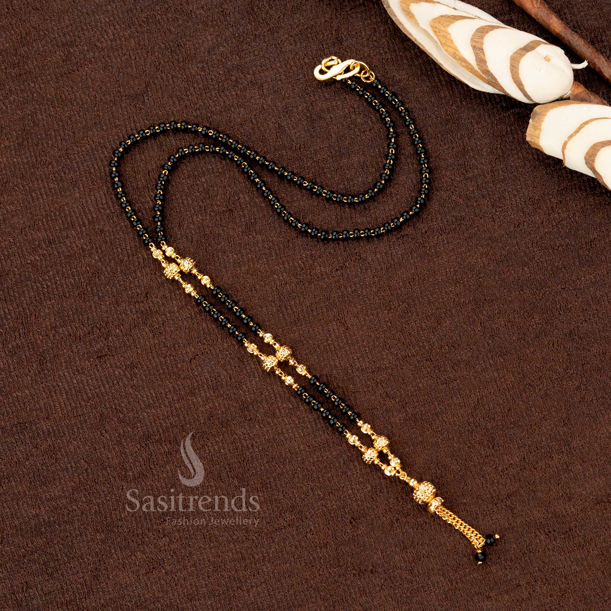 Majestic black beads mangalsutra with micro gold plating and an ornate beaded chain, ideal for wedding and festive occasions - Sasitrends