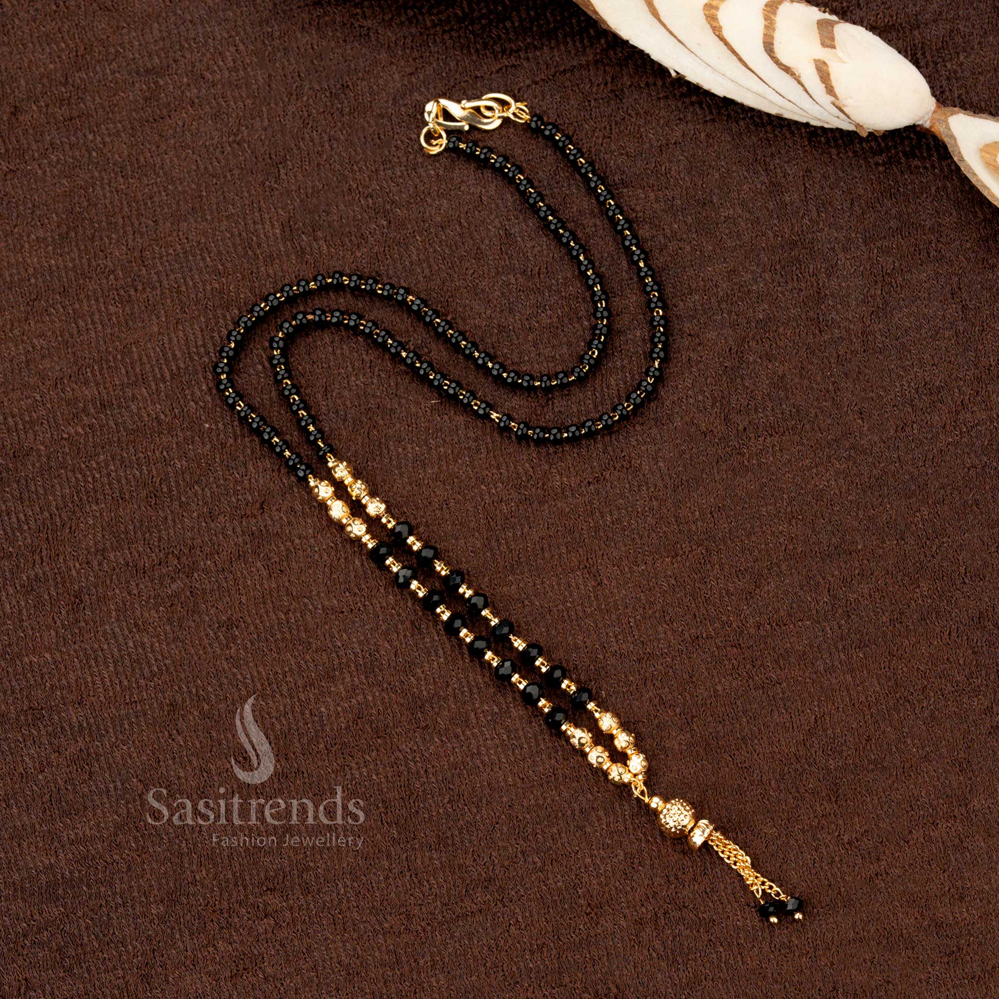 Exquisite gold-plated beaded mangalsutra with black beads, featuring intricate handcrafted details for a luxurious touch - Sasitrends