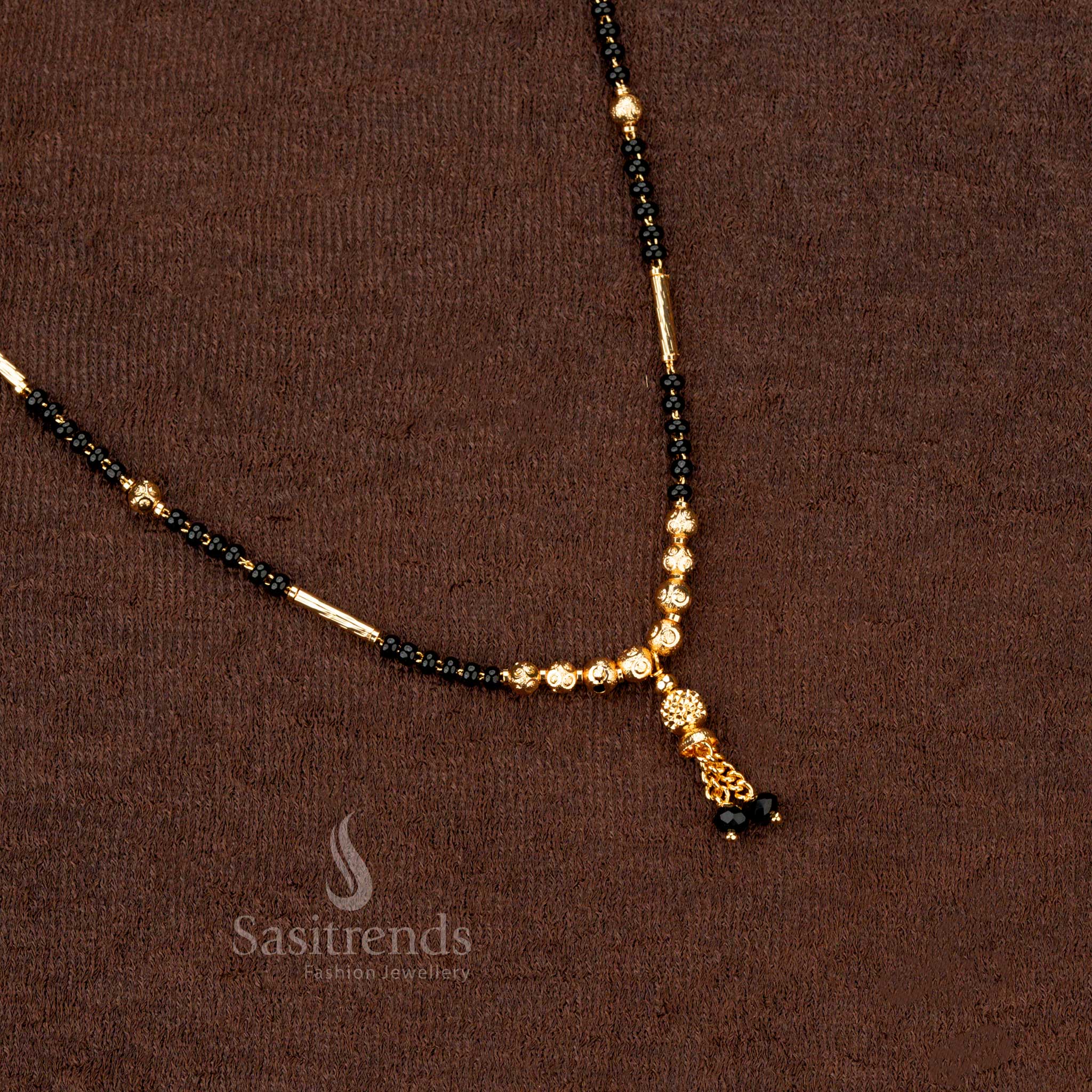 Designer ethnic gold-plated black beads mangalsutra with a beautifully crafted beaded chain, ideal for bridal jewellery collections - Sasitrends