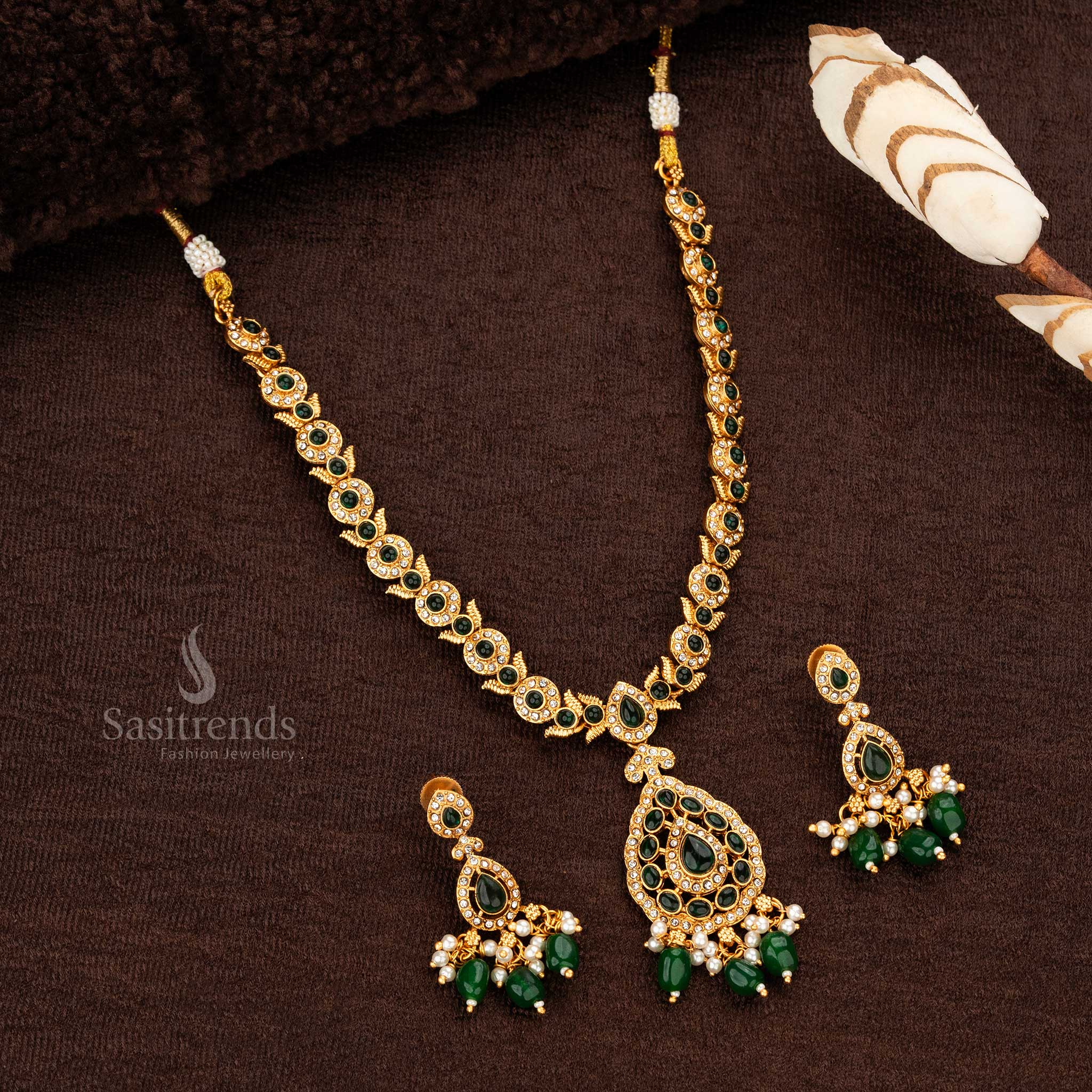 Temple matte gold necklace set with green bead accents 