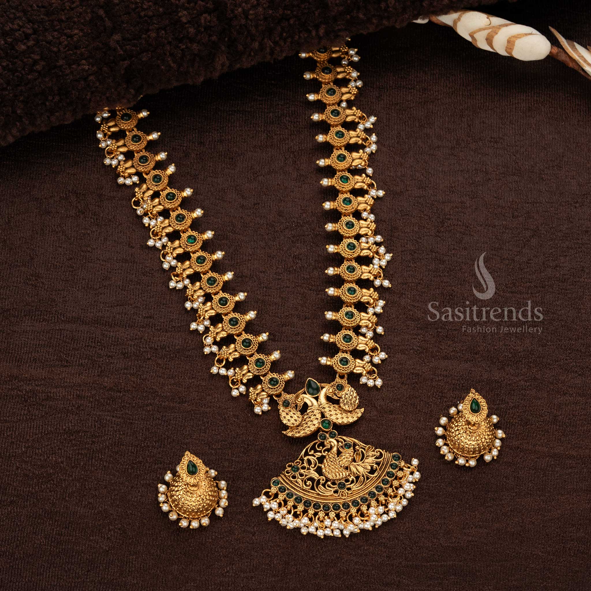 Classic matte gold-plated temple peacock long haram necklace with elegant green stones, ideal for cultural and traditional celebrations - Sasitrends