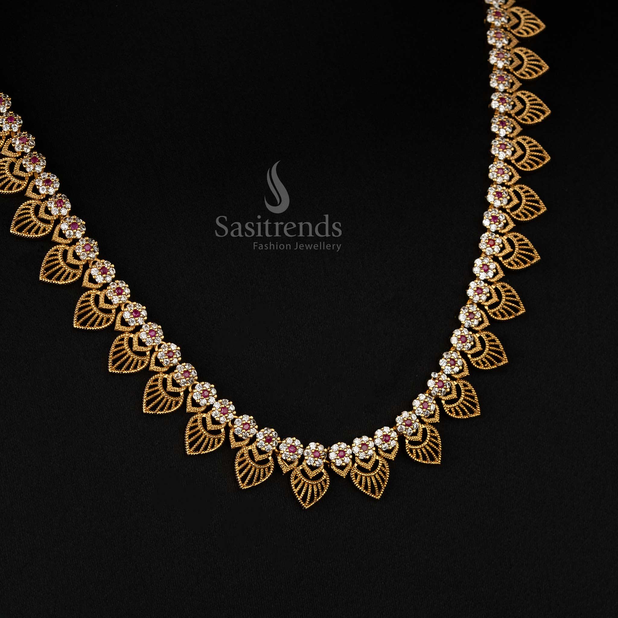 White Ruby Intricately designed matte gold temple necklace set with floral and leaf engravings – Sasitrends