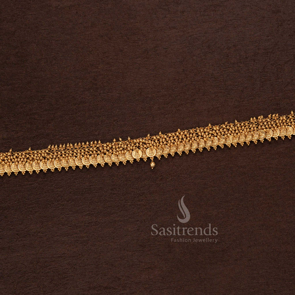 Matte gold plated temple hip belt with small Lakshmi coins, golden bead detailing, and structured design – Sasitrends