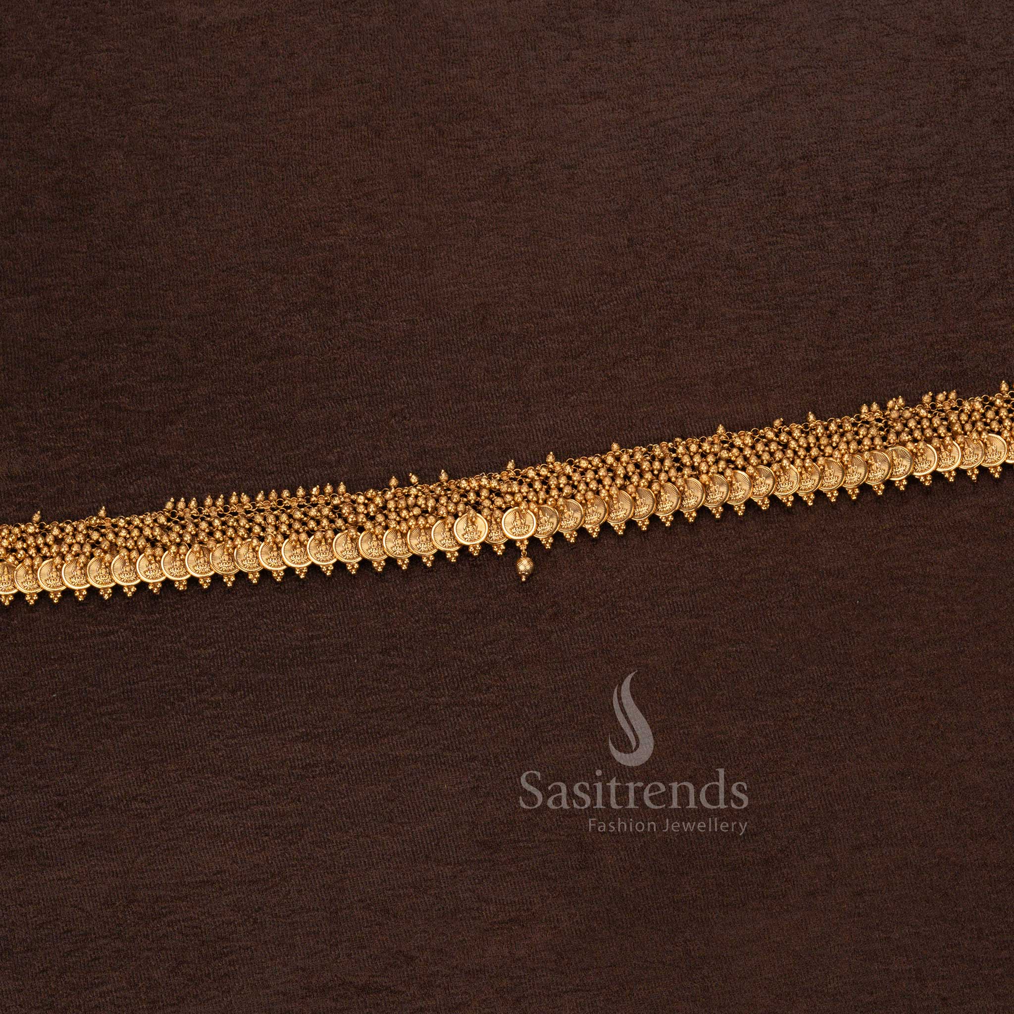 Matte gold plated temple hip belt with small Lakshmi coins, golden bead detailing, and structured design – Sasitrends