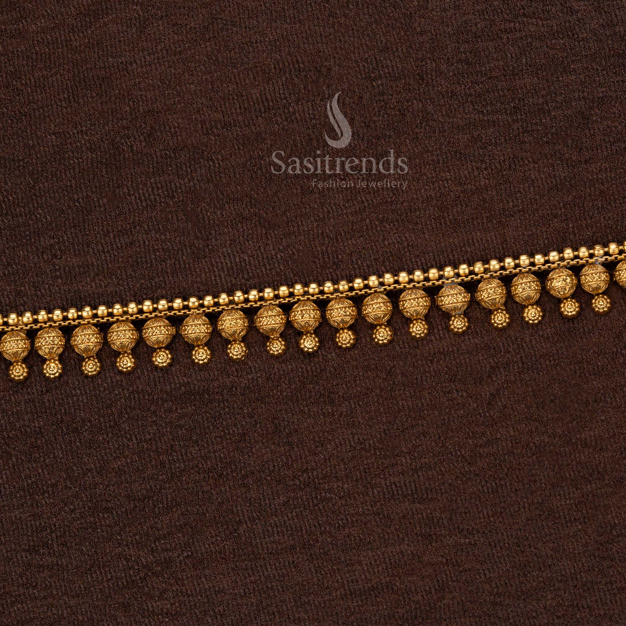 Luxury temple jewellery waist belt with an array of finely crafted golden beads, intricate carvings, and traditional bead dangles – Sasitrends