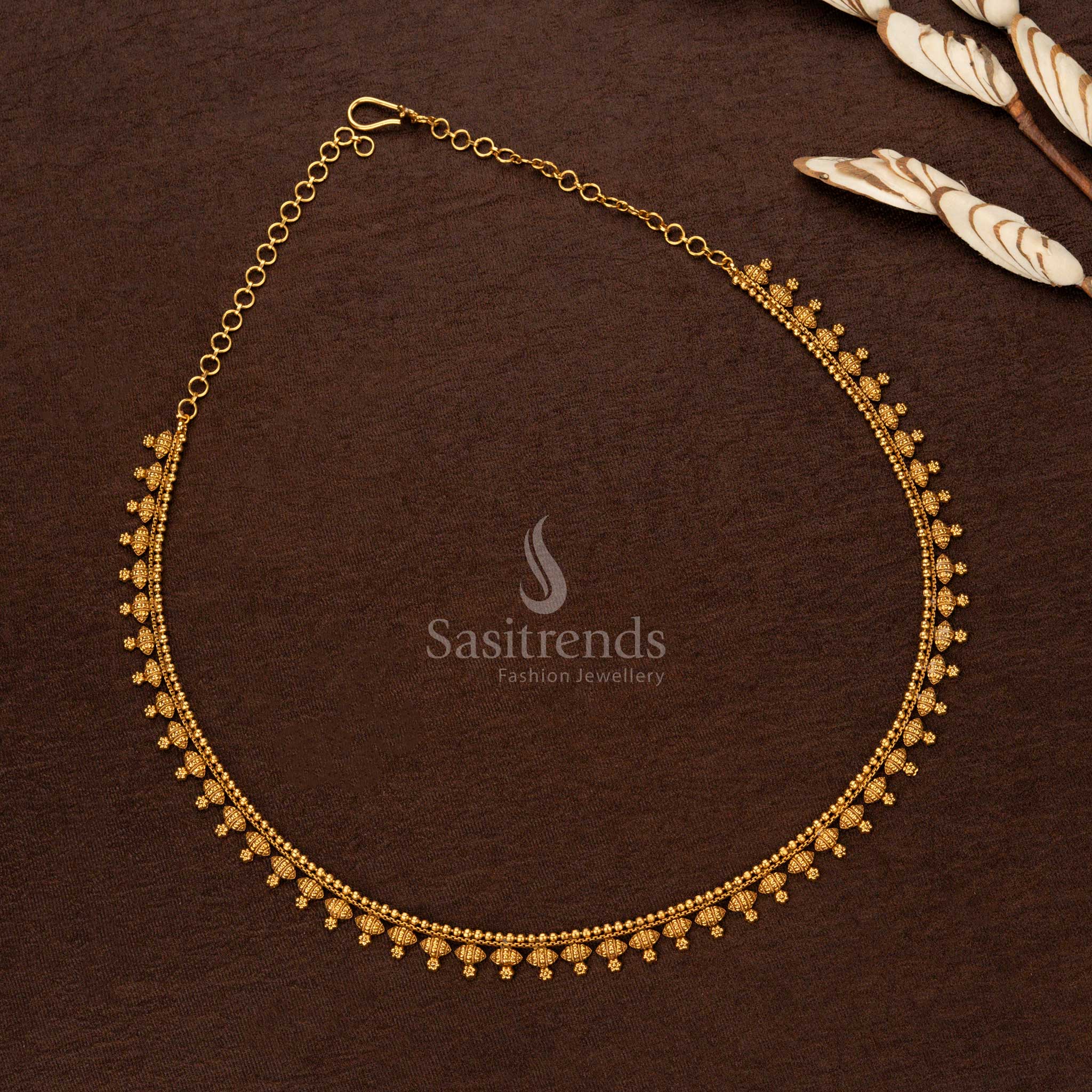 Heritage-inspired matte gold temple vaddanam with intricate hanging bead detailing, grand temple artistry, and delicate beads – Sasitrends