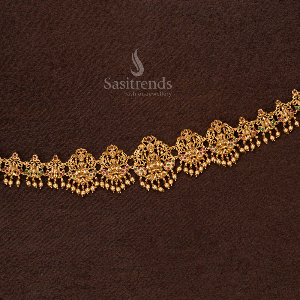 Luxurious matte gold temple hip chain featuring a grand Goddess Lakshmi pendant, majestic peacock artwork - Sasitrends