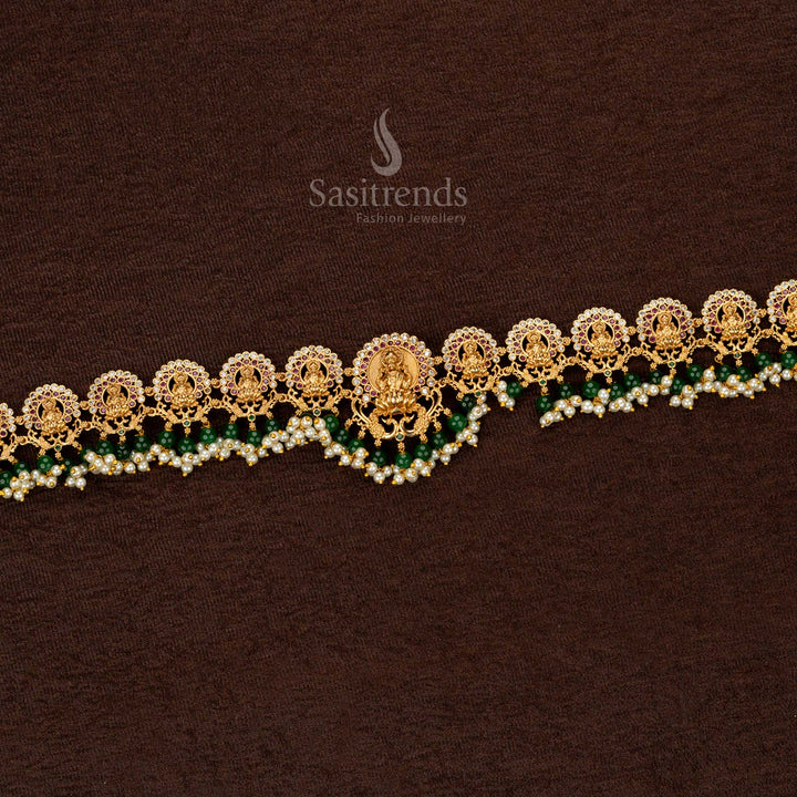 Handcrafted temple matte gold hip belt with divine Lakshmi engraving, enriched with green agate pearls, a timeless addition to luxury heritage jewellery collection - Sasitrends