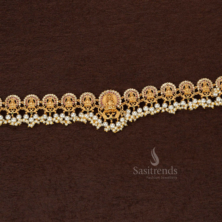 Antique-finish matte gold temple hip belt showcasing a divine Lakshmi motif with exquisite full pearl embellishment, a masterpiece in handcrafted heritage jewellery - Sasitrends