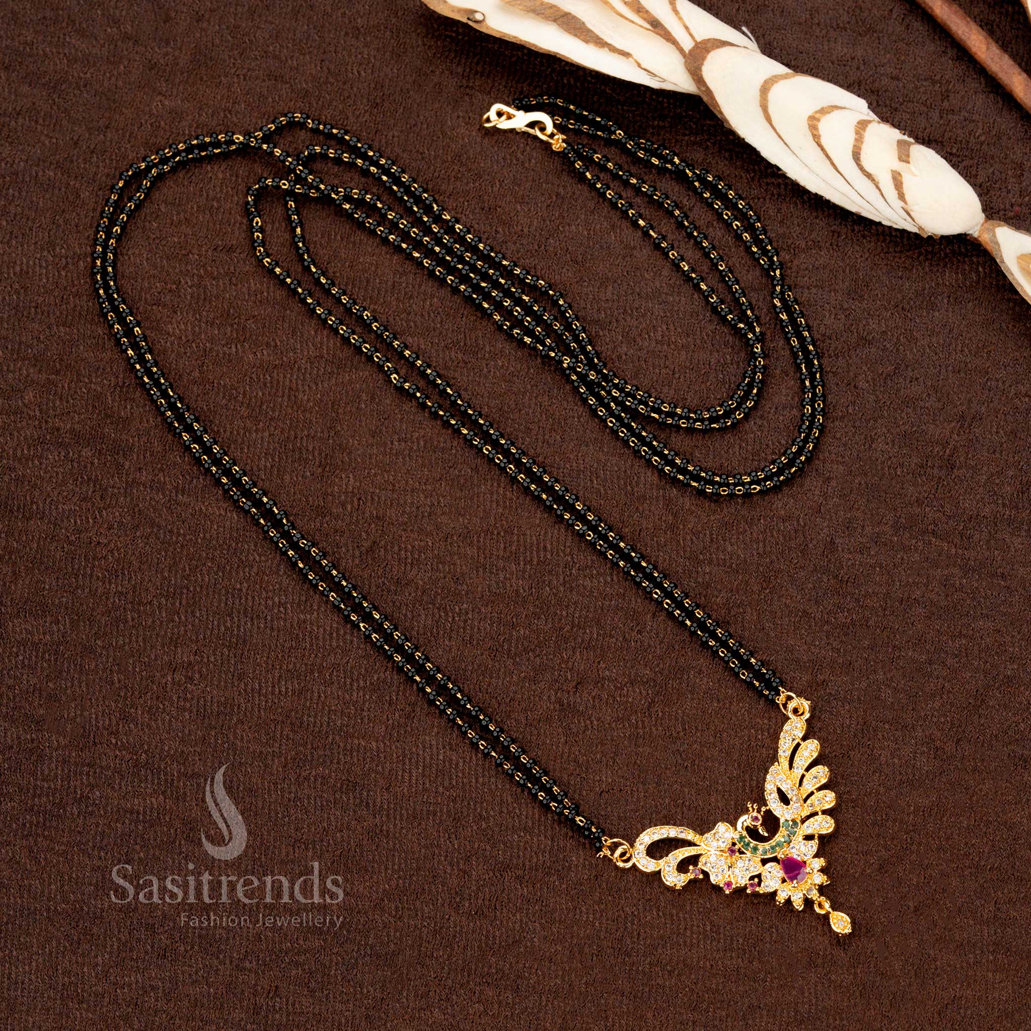 Designer traditional gold-plated mangalsutra with black beads and a shimmering AD pendant for an exquisite fashion statement - Sasitrends