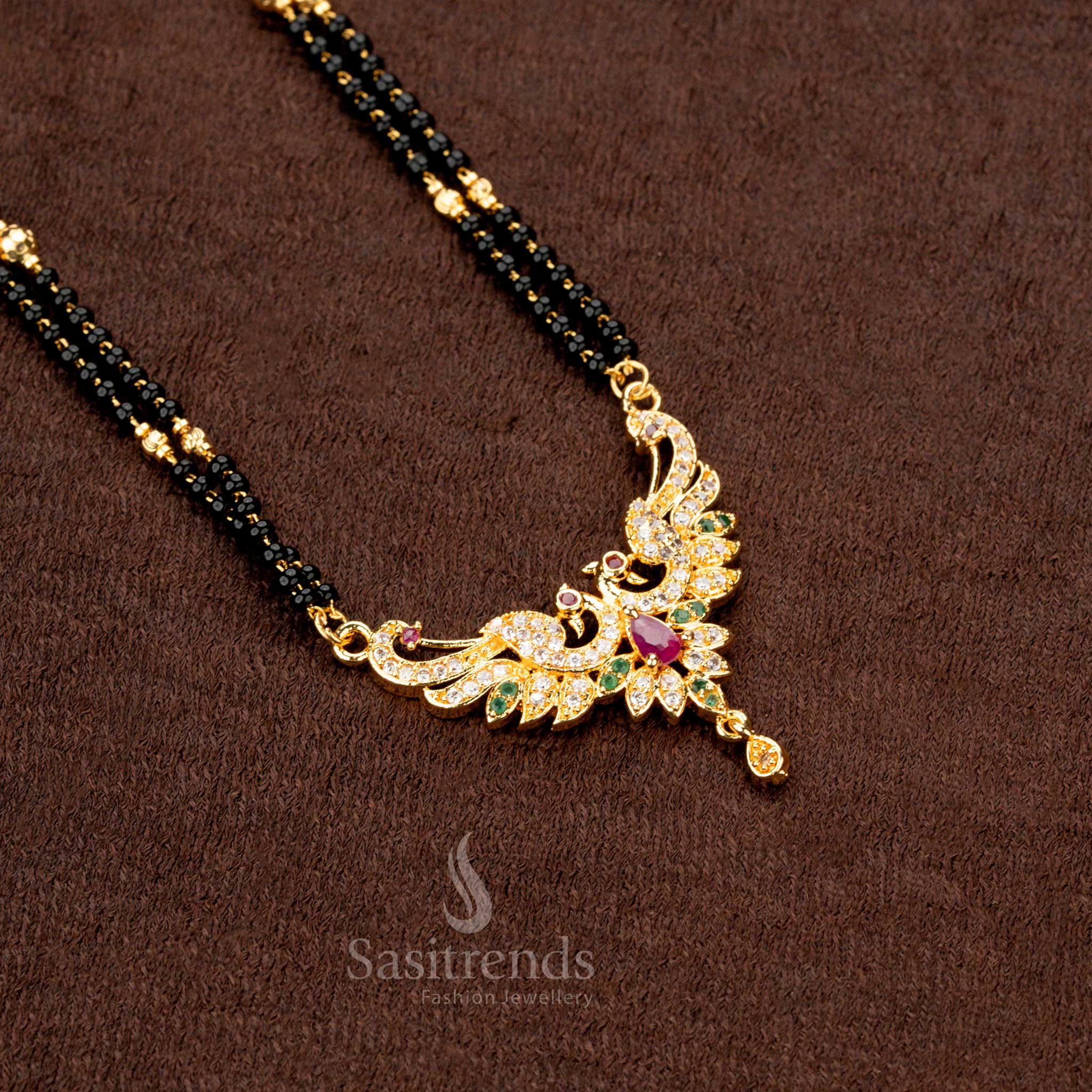 Elegant bridal wear black beads mangalsutra with an ornate gold-plated AD pendant, ideal for festive occasions - Sasitrends