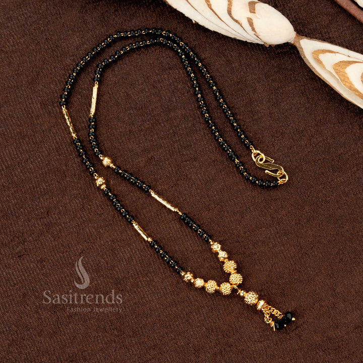 Contemporary traditional gold-plated black beads mangalsutra featuring a designer beadwork pattern, blending modern style with tradition - Sasitrends