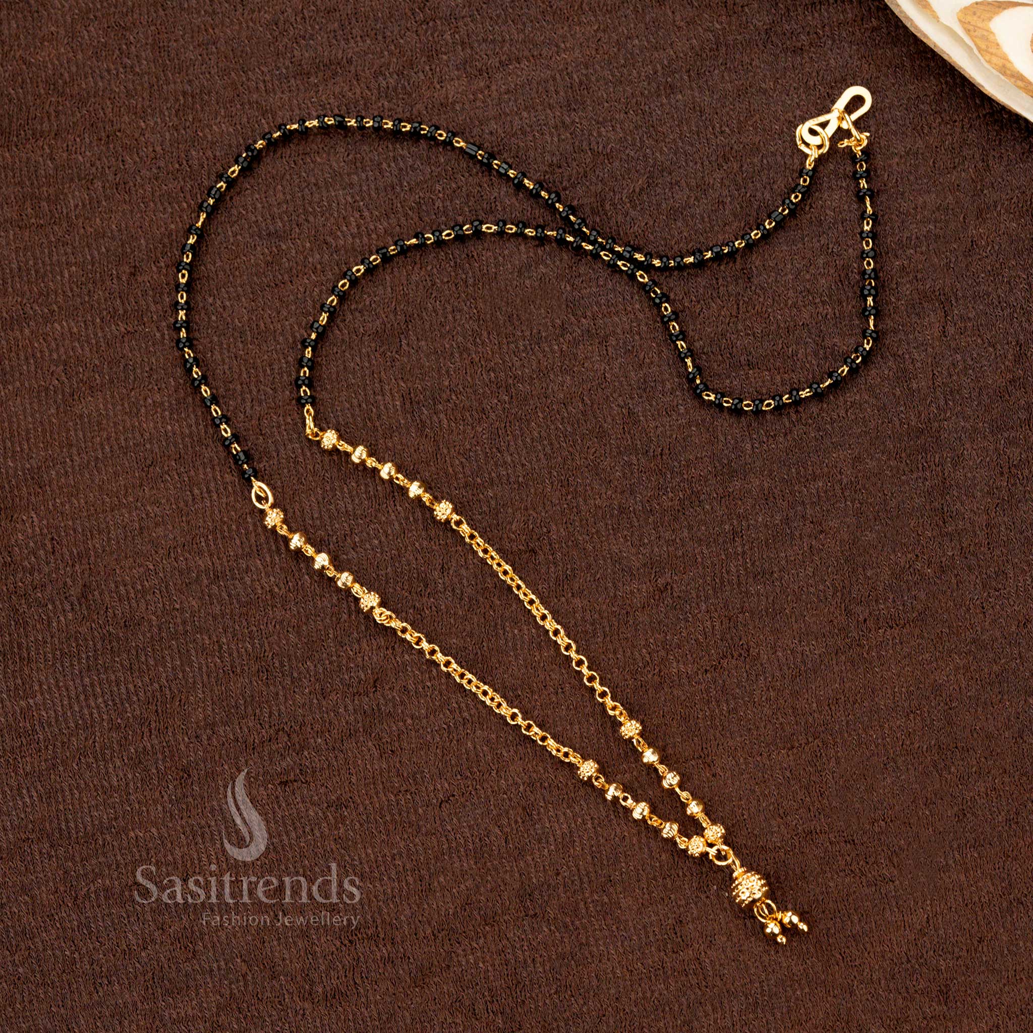 Handcrafted gold-plated black beads mangalsutra with traditional ethnic beadwork design, reflecting elegance and cultural heritage - Sasitrends