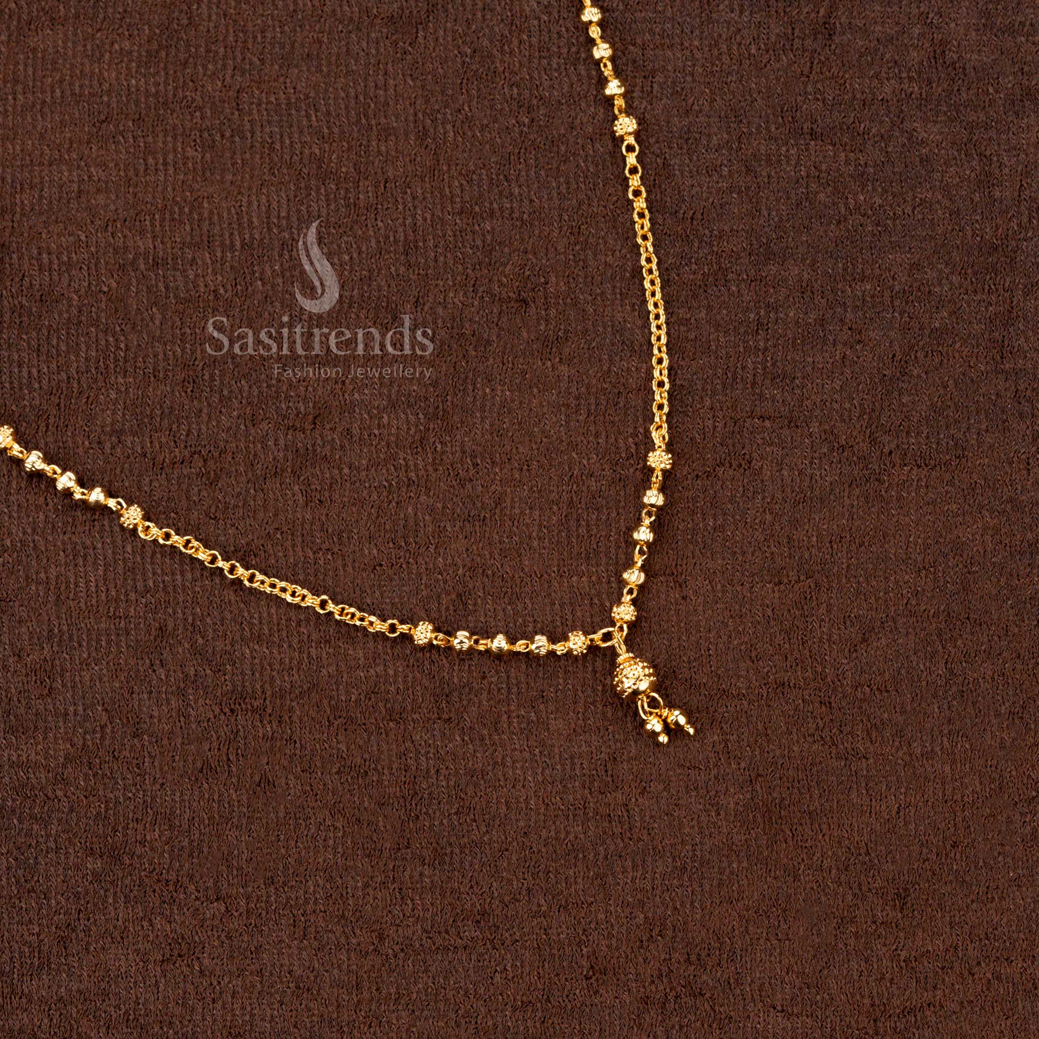 Radiant black beads mangalsutra with gold plating and artistic handcrafted beadwork, an ideal pick for festive occasions - Sasitrends