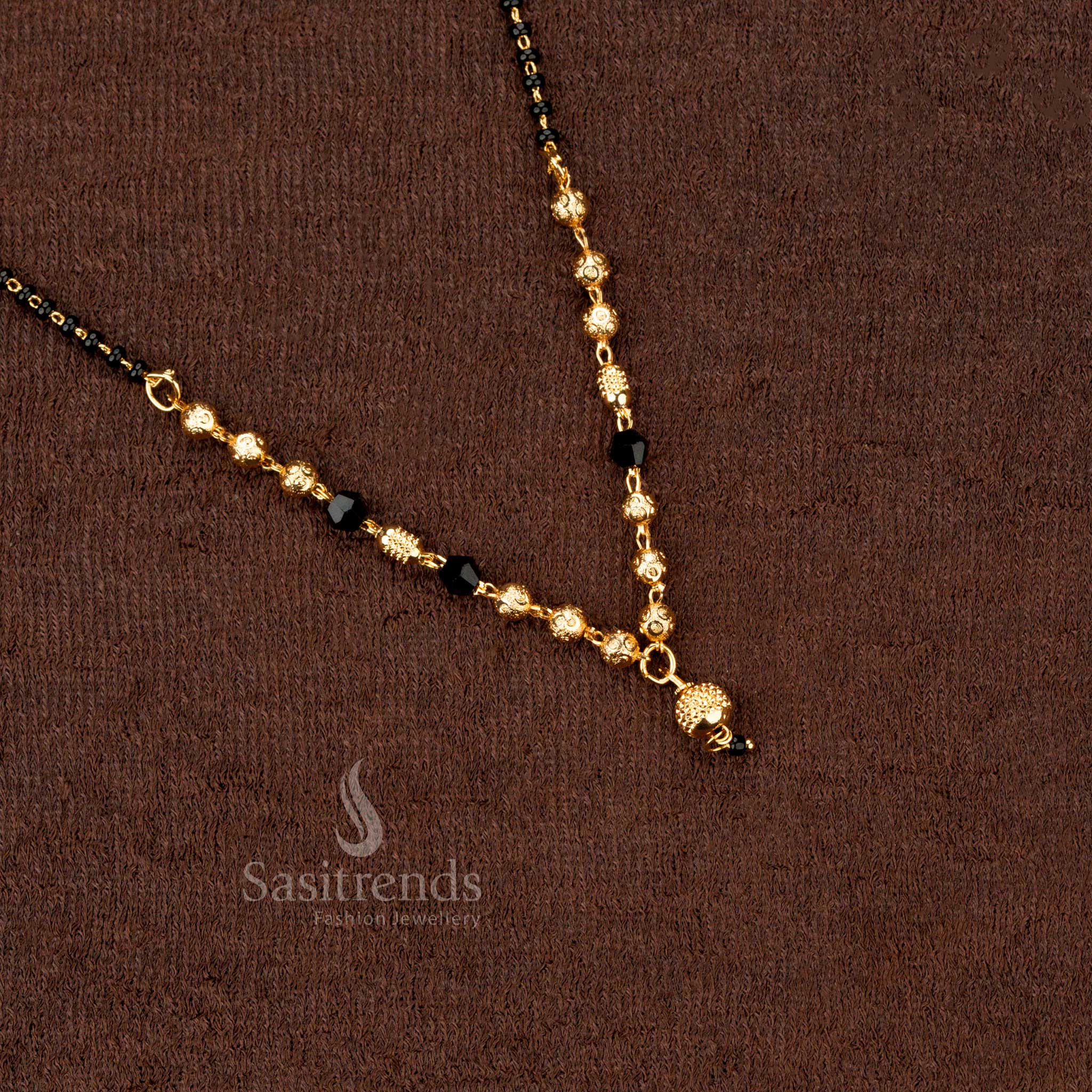 Designer ethnic gold-plated mangalsutra with black beads and ornate beadwork, exuding charm and grace - Sasitrends