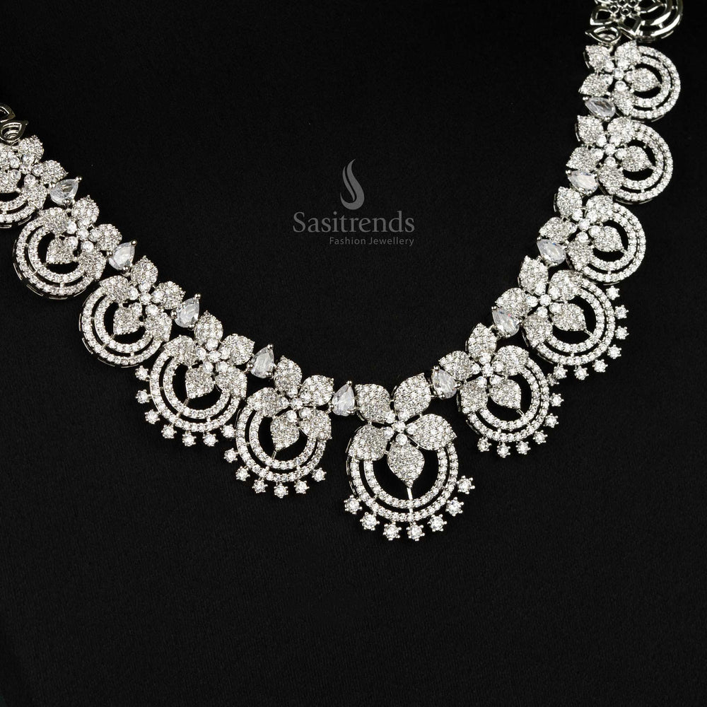 Stunning rhodium silver-plated jewellery set adorned with intricate circular motifs and sparkling American diamonds, perfect for bridal and festive occasions - Sasitrends