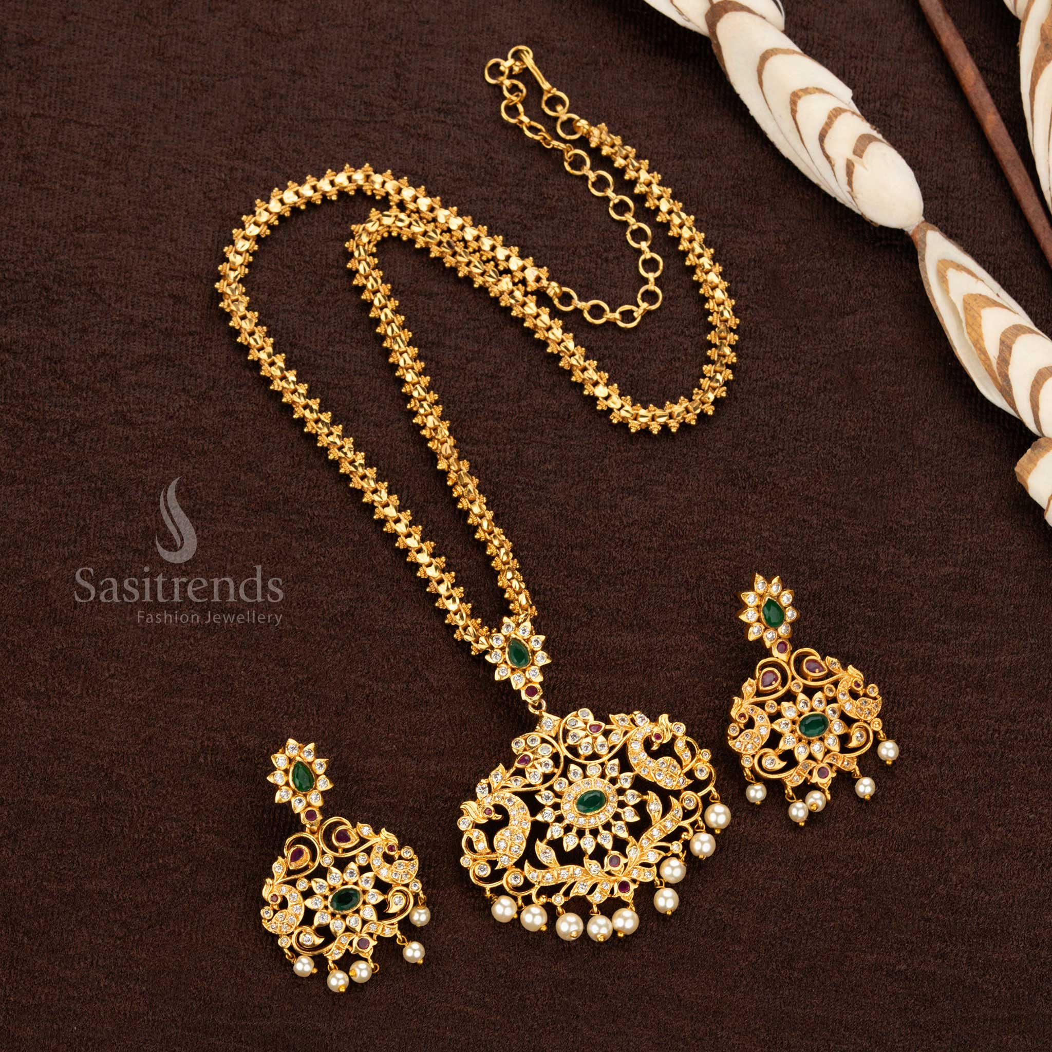 Trendy temple matte gold-plated floral peacock pendant long jewelry set for women, adorned with American diamonds - Sasitrends