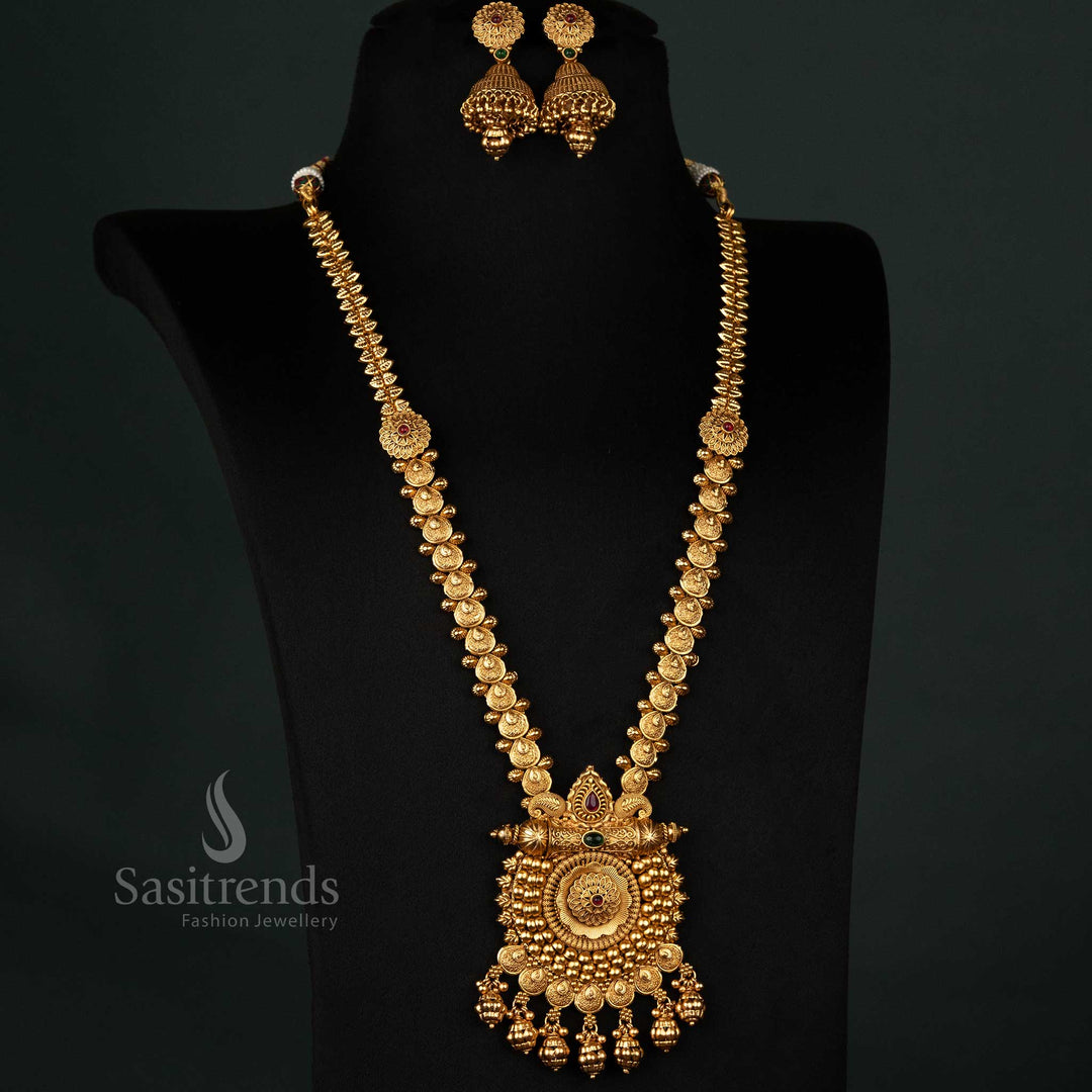 Handcrafted vintage-inspired long necklace in antique gold finish, adorned with ruby-green AD stones and beautifully detailed ethnic jhumkas, perfect for traditional wear - Sasitrends