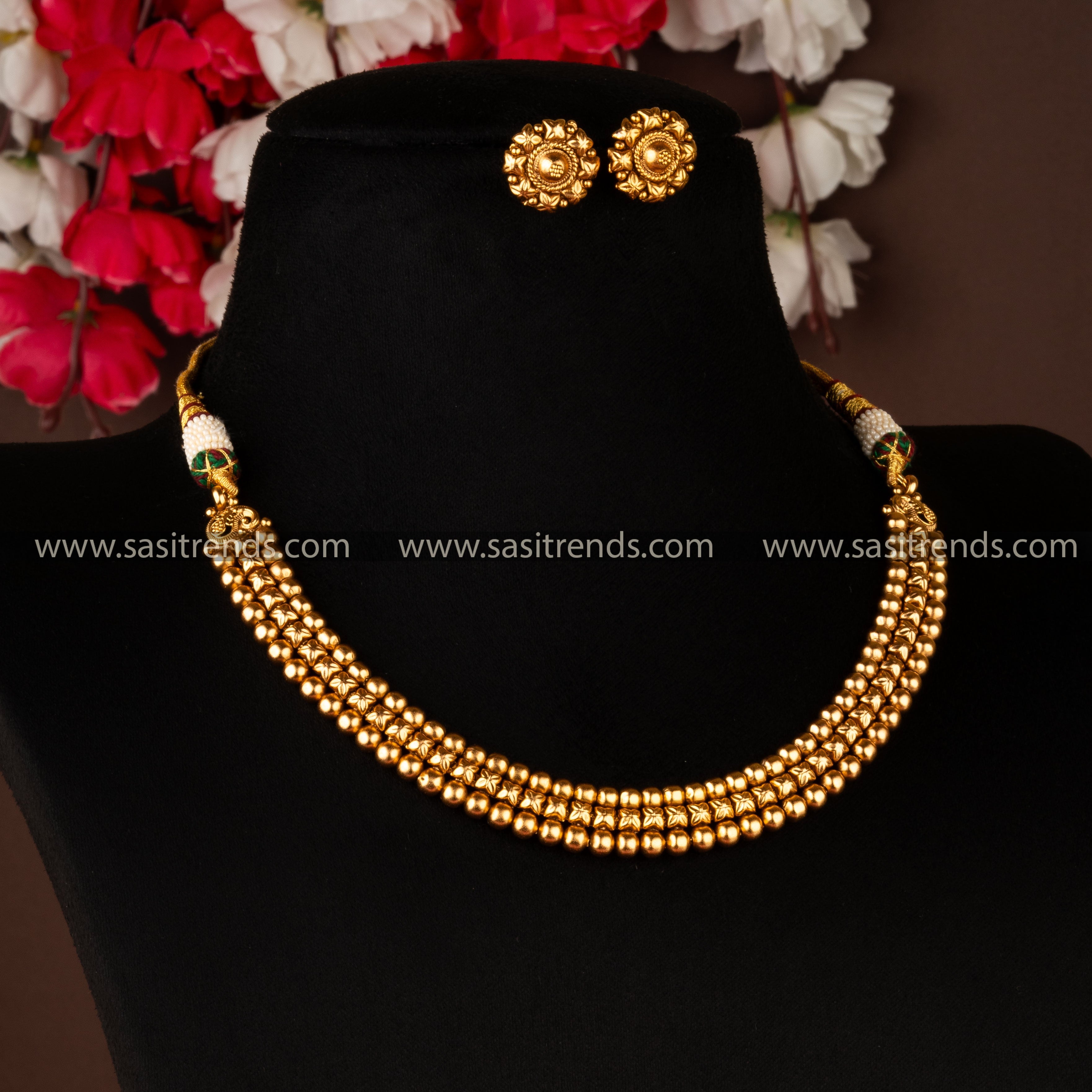 Traditional antique gold-plated jewellery set with floral and ball patterns, ideal for cultural events