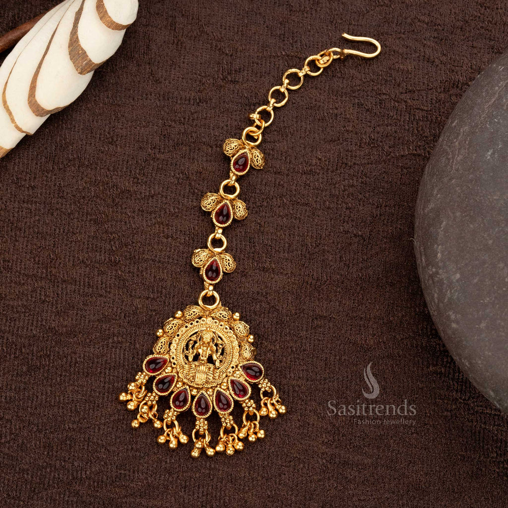 Lakshmi matte gold plated motif maang tikka with ruby tear-drop synthetic stones and pearls - Sasitrends