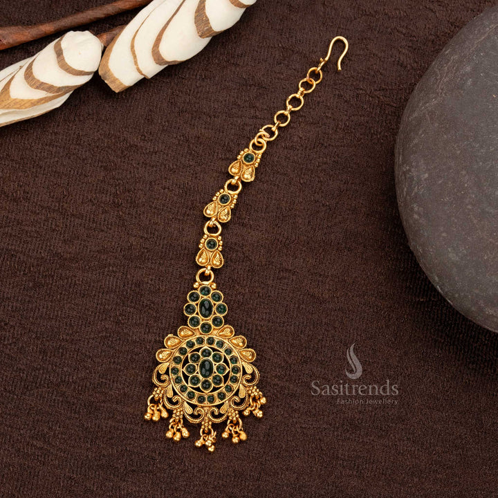 Elegant Temple Maang Tikka with green stones, floral pendant, and ball hangings - Sasitrends