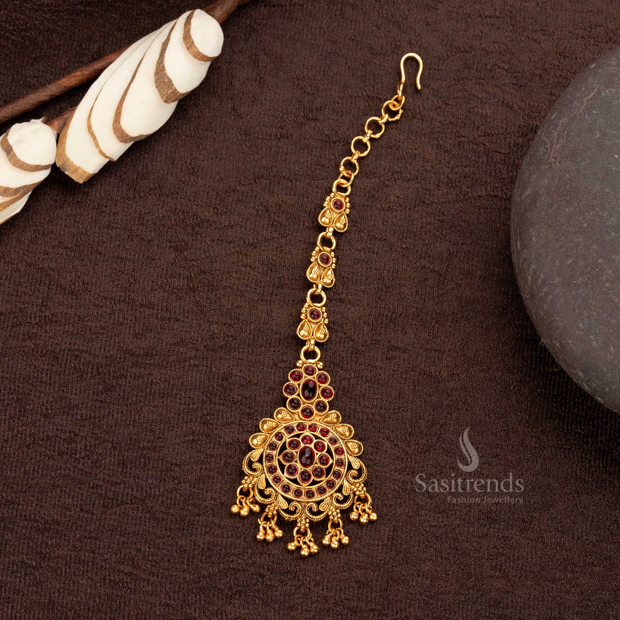 Classic matte gold Temple Maang Tikka with ruby stones and golden ball hangings  - Sasitrends