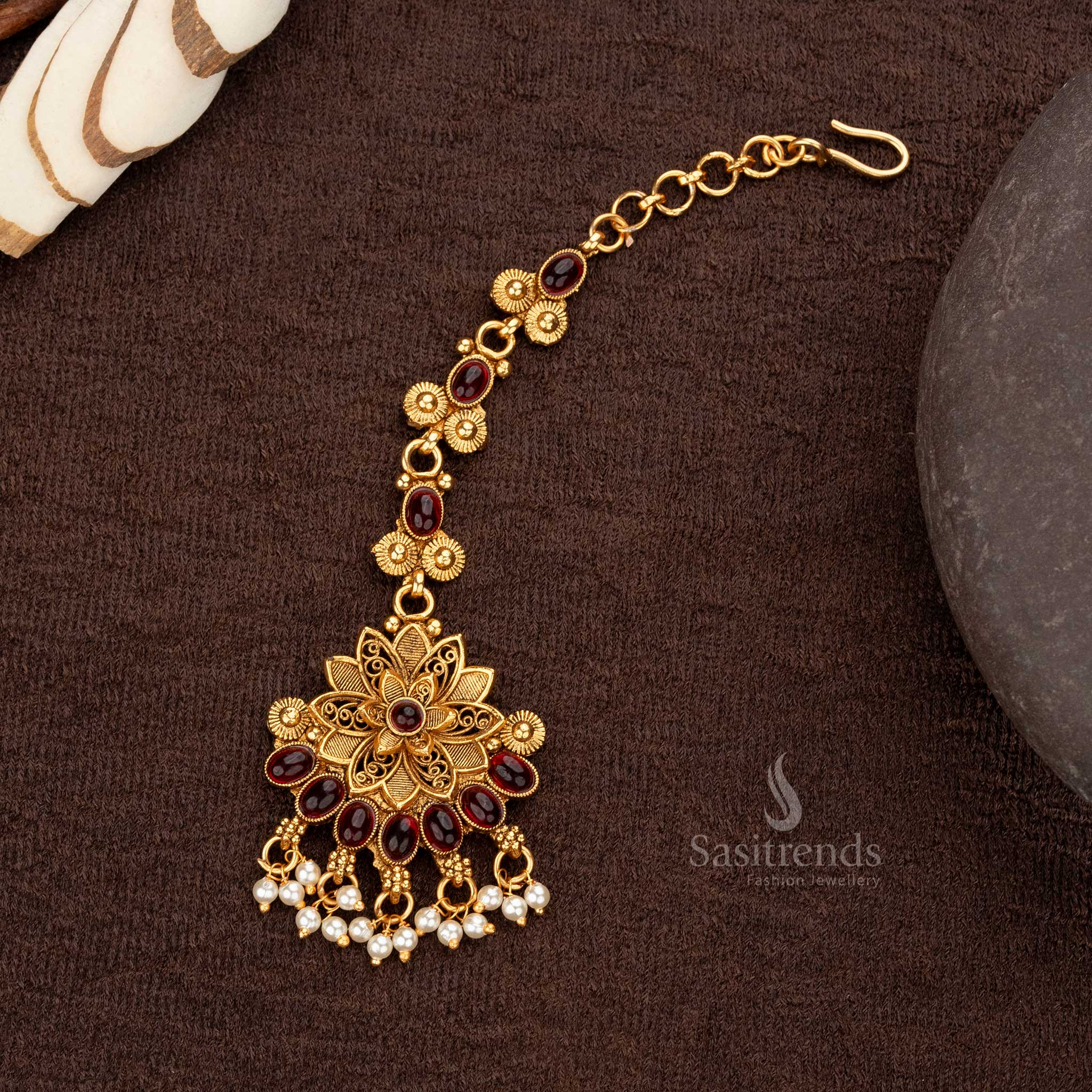 Ruby classic matte gold plated maang tikka with floral motif and pearl hangings - Sasitrends