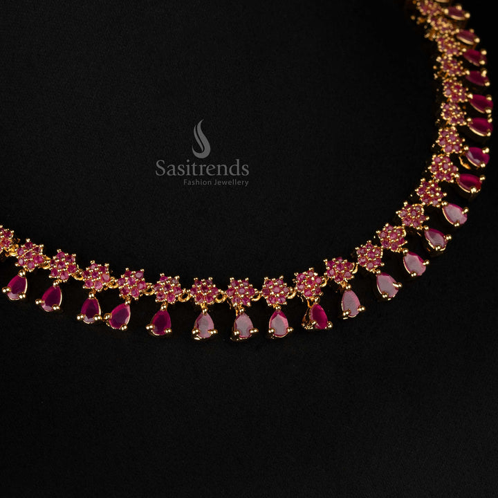 Ruby-accented micro gold-plated jewellery set featuring floral designs and American diamond stones - Sasitrends