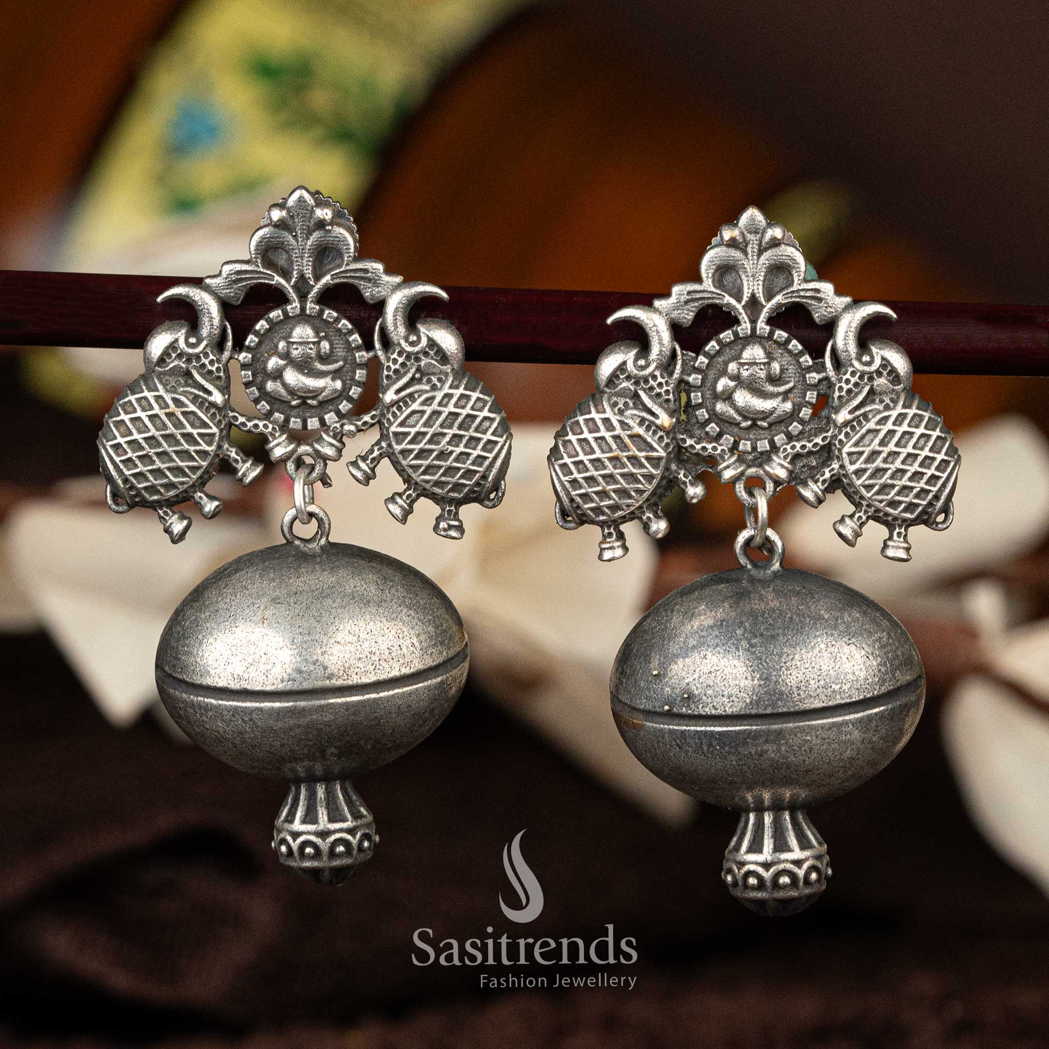 Statement oxidised silver earrings with traditional elephant motifs - Sasitrends