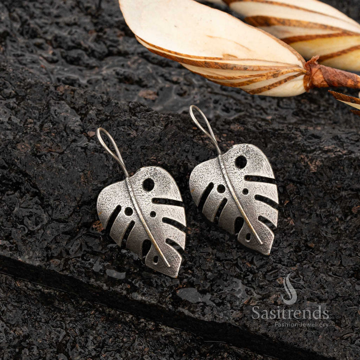 Textured oxidised Monstera leaf earrings with fish hook closure